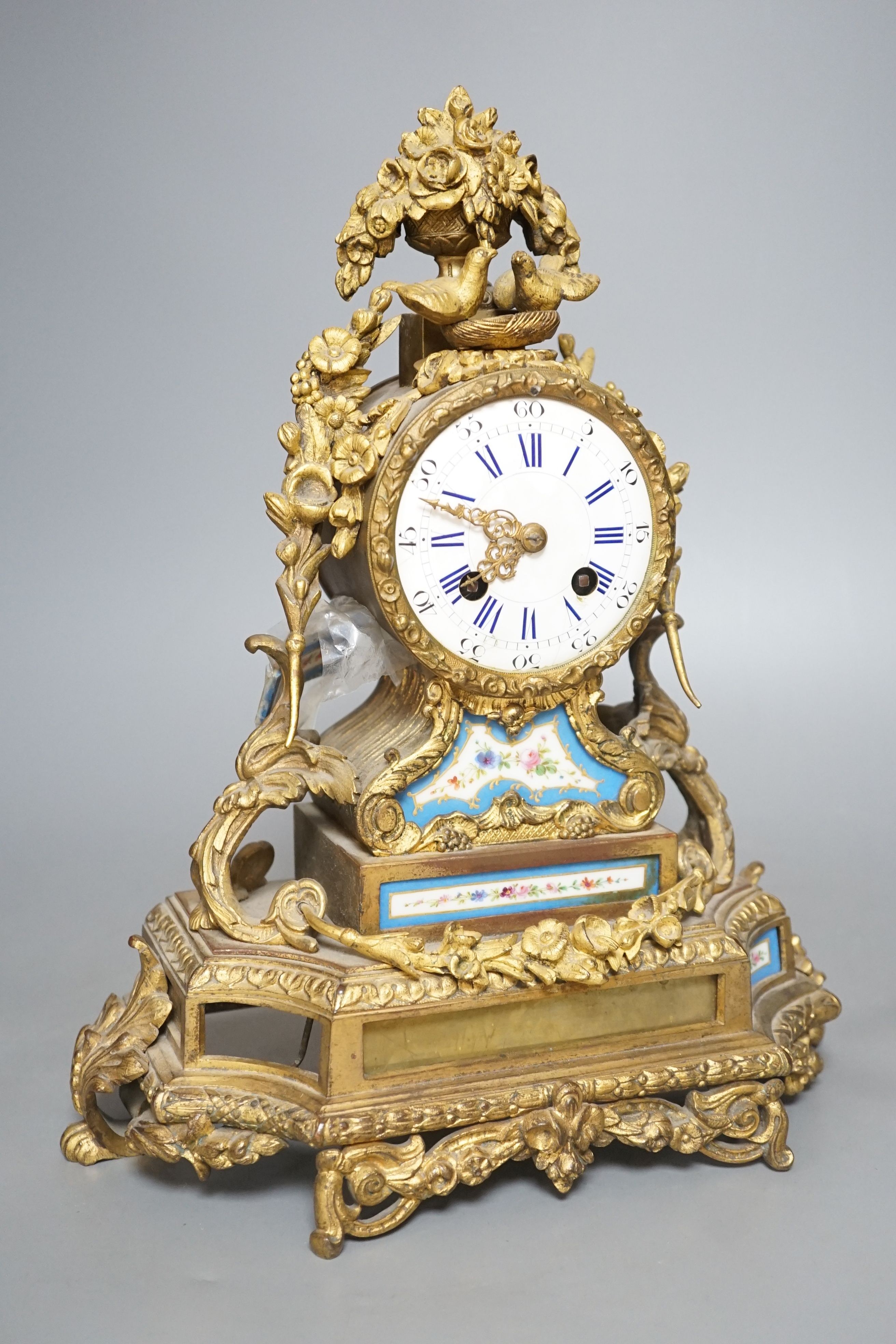 A 19th century French Sevres style porcelain and ormolu mantel clock - 35cm tall